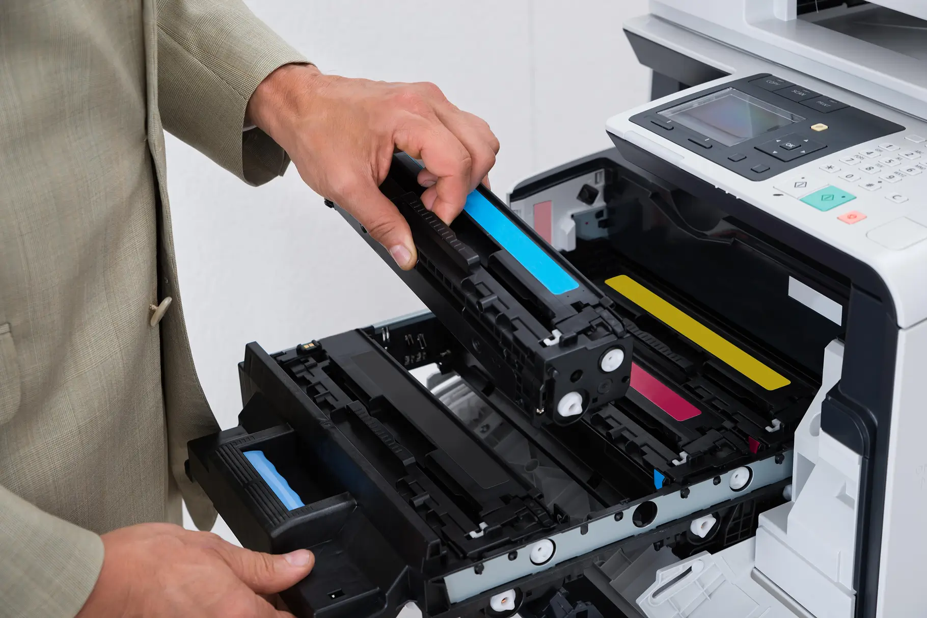 Technician replacing a toner cartridge in a printer in Abu Dhabi