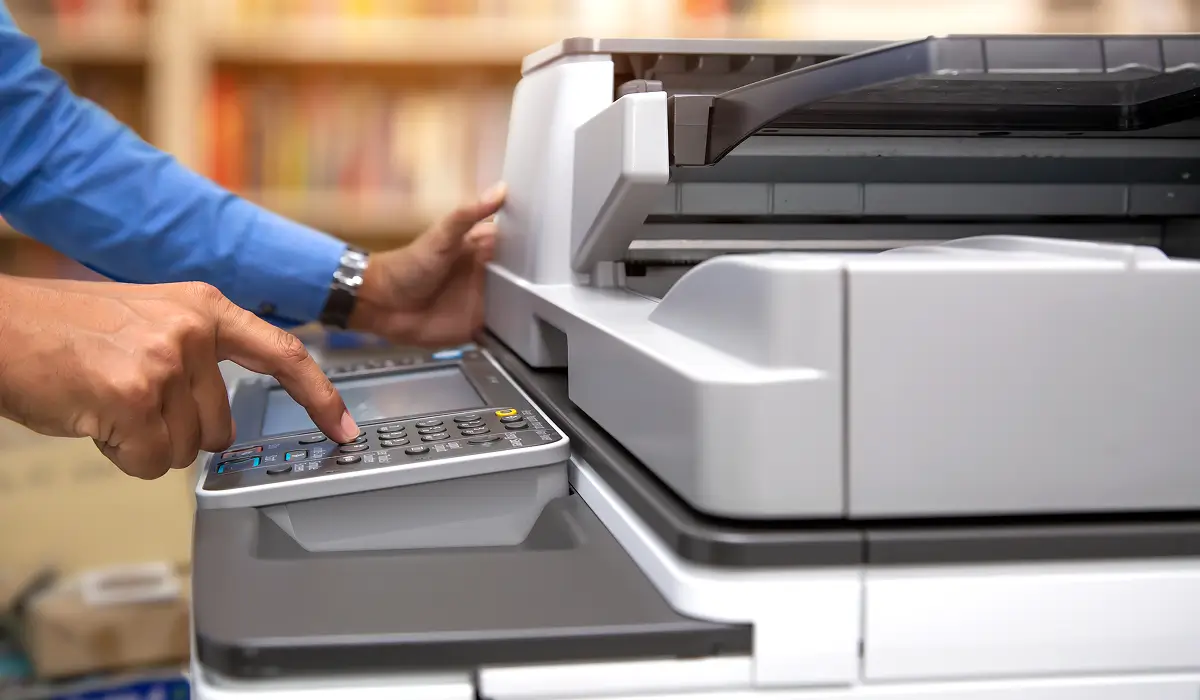 Business team using a rented multifunction printer in Mussafah